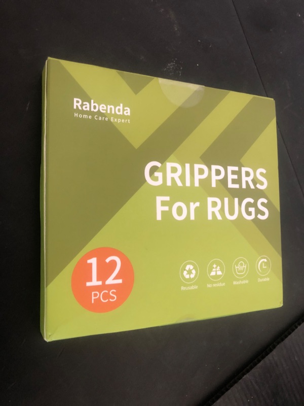 Photo 1 of Rabenda 12 Pcs Rug Tape, Non Slip Rug Pads Grippers for Hardwood Floors and Tiles, Reusable Carpet Tape for Area Rugs, Double-Sided Adhesive Rug Stickers Keep Corners Flat (Black)