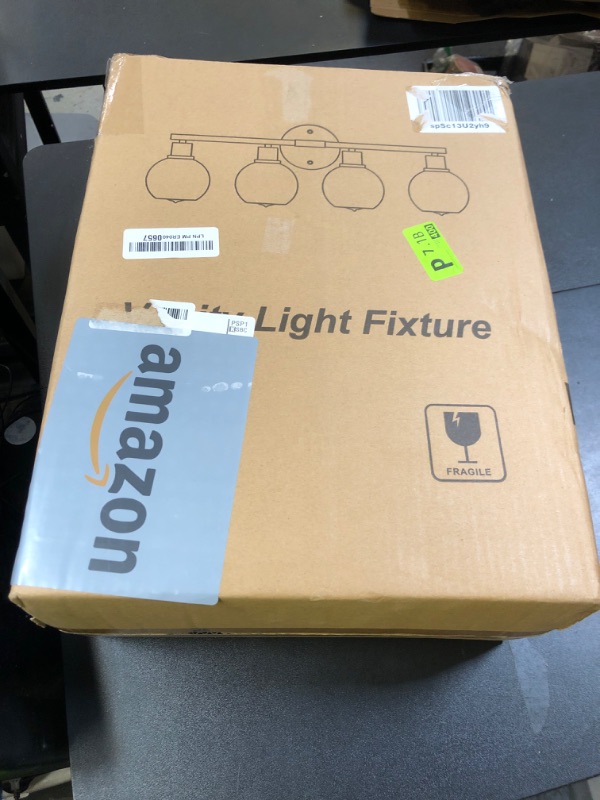 Photo 1 of Indoi 4-Light Bathroom Light Fixtures, Oil Rubbed Bronze Bathroom Lights Over Mirror with Clear Glass Globe Shade, Vanity Lights for Bathroom Kitchen Living Room Hallway Cabinet Bedroom Porch