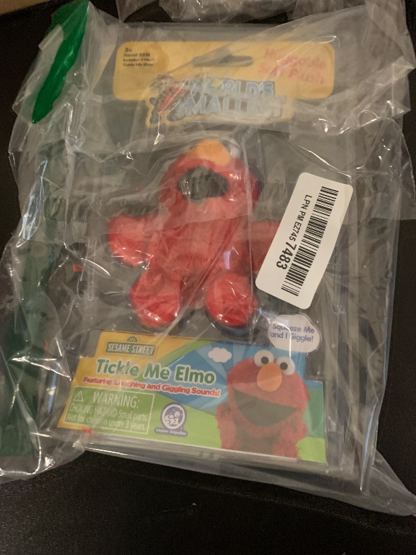 Photo 1 of World's Smallest Tickle Me Elmo Miniature 4-inch Plush Doll, Giggles and Laughs | Sesame Street Soft Plush | for Ages 8 and up
