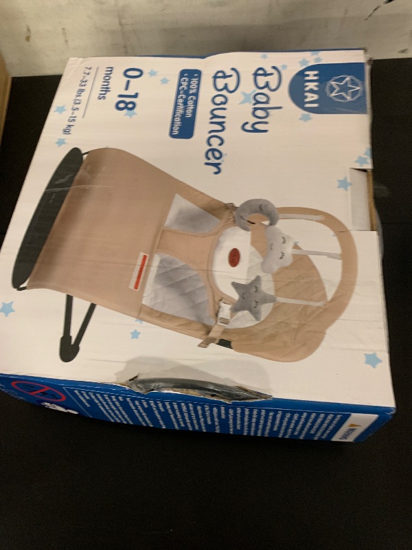 Photo 1 of HKAI Baby Bouncer, Portable Baby Bouncer Seat for Babies 0-18 Months, 100% Cotton Fabrics, 3 Modes of use with Rocker and Stationary Options, Infant Rocker Chair with Hanging Toys-Organic Oat