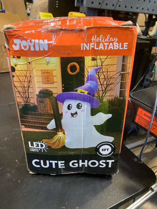 Photo 1 of JOYIN 6 FT Tall Halloween Inflatables Ghost Outdoor Decorations, Cute Blow Up Ghost Holding Broom with LED, Blow Up Yard Decorations for Halloween Outdoor Yard Garden Lawn Party Decor