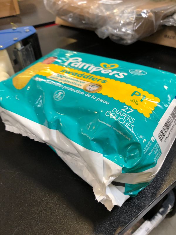 Photo 1 of Pampers Baby Diapers - Swaddlers - Size P1, 27 Count, Ultra Absorbent Disposable Preemie Diaper PACKAGING MAY VARY