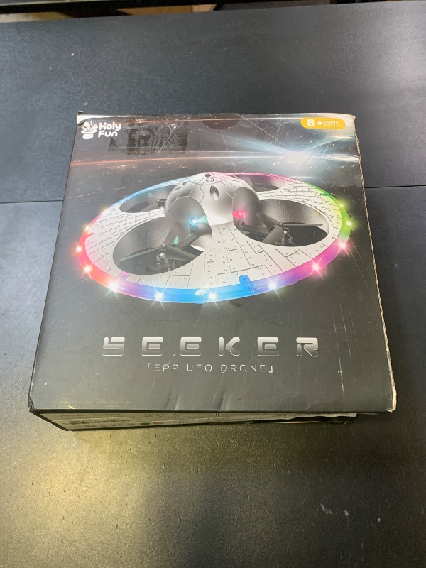 Photo 1 of Foam UFO Drone for Kids – RC Plane with Colorful LED Lights, Remote Control Helicopter with Auto Hover, 2 Batteries (15 Mins Flight)