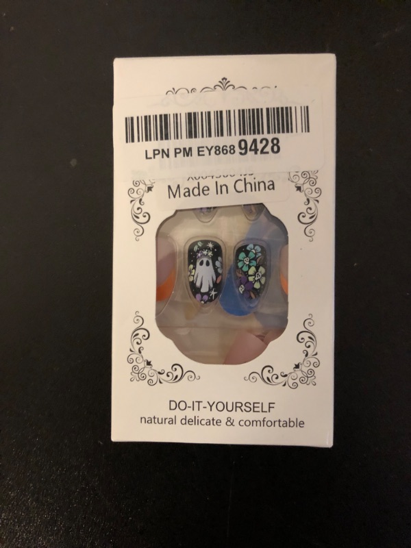 Photo 1 of Halloween Press on Nails French Tip Nails Press Ons Short Almond Fake Nails Cute Ghost False Nail with Skeleton Flower Designs Stick on Acrylic Nail Halloween Glue on Nail for Women 24Pcs