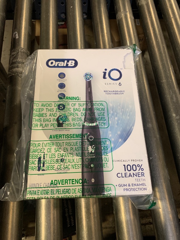 Photo 1 of Oral-B iO Series 6 Rechargeable Electric Toothbrush with Visible Pressure Sensor to Protect Gums, 2 Minute Timer, 5 Cleaning Settings, 1 Replacement Toothbrush Head, and Travel Case, Black