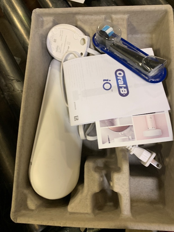 Photo 1 of Oral-B iO Series 6 Rechargeable Electric Toothbrush with Visible Pressure Sensor to Protect Gums, 2 Minute Timer, 5 Cleaning Settings, 1 Replacement Toothbrush Head, and Travel Case, Black