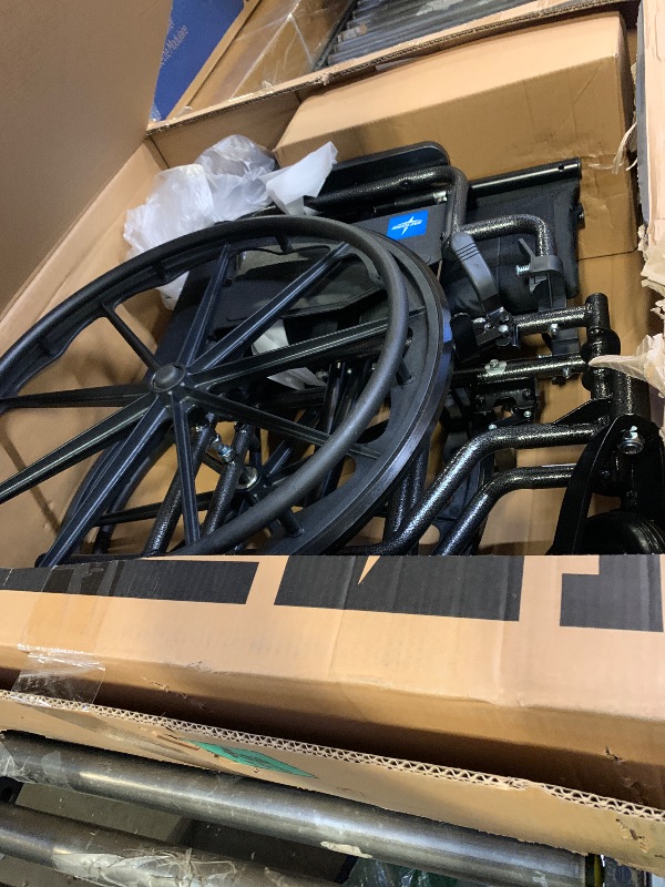 Photo 1 of Medline Comfortable Folding Wheelchair with Swing-Back, Desk-Length Arms and Elevating Footrests, 20”W x 16”D Seat