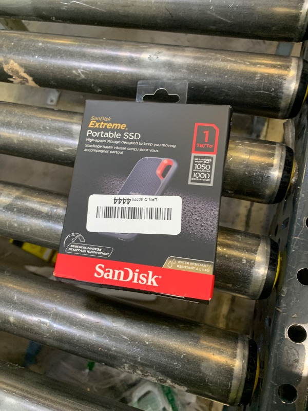 Photo 1 of SanDisk 1TB Extreme Portable SSD - Up to 1050MB/s, USB-C, USB 3.2 Gen 2, IP65 Water and Dust Resistance, Updated Firmware - External Solid State Drive - SDSSDE61-1T00-G25