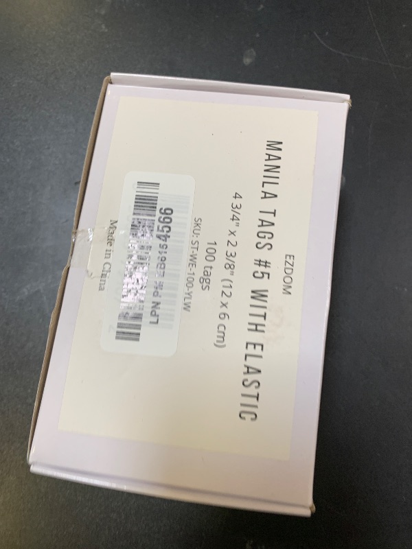 Photo 1 of Tags with Elastic String Attached - #5, 4 3/4" x 2 3/8" Box of 100 Manila Paper Label Tags with Elastic Loop and Reinforced Hole