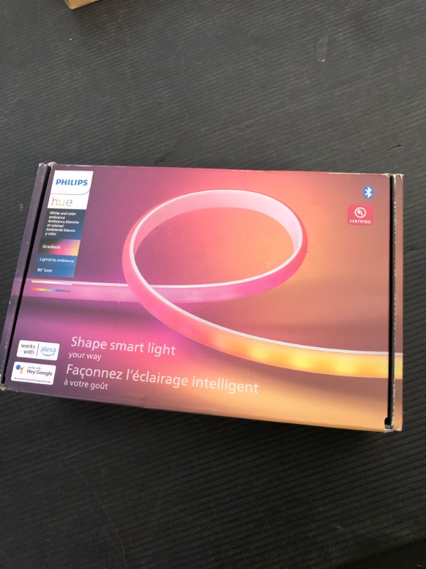 Photo 1 of Philips Hue Indoor 6-Foot Smart LED Light Strip Base Kit with Plug - Flowing Multicolor Effect - 1 Pack - Control with Hue App - Works with Alexa, Google Assistant and Apple HomeKit