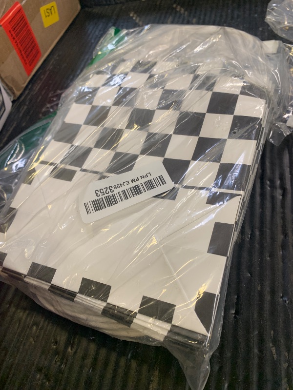 Photo 1 of Gersoniel 24 Pieces Checkered Race Treat Bags White Black Checkered Bags Racecar Themed Candy Containers Plaid Kraft Paper Race Car Party Favors Shopping Goodies Pouches with Handle for Birthday