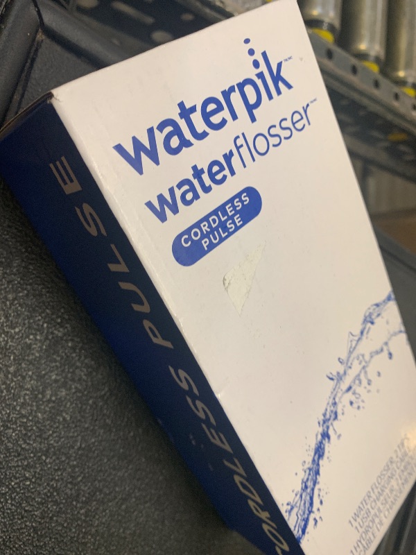 Photo 1 of Waterpik Cordless Pulse Rechargeable Portable Water Flosser for Teeth, Gums, Braces Care and Travel with 2 Flossing Tips, Waterproof, ADA Accepted, WF-20 White, Packaging May Vary