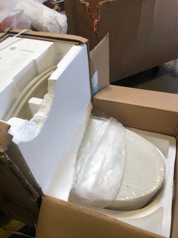Photo 1 of Swiss Madison St. Tropez One Piece Elongated Toilet Side Flush 1.28 gpf with Black Hardware, Glossy White