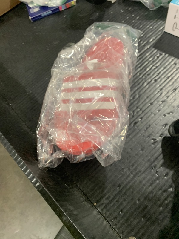 Photo 1 of adidas Unisex Adilette Shower Slide Sandal, Vivid Red/White/Vivid Red, 11 US Women