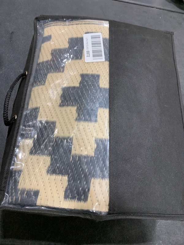 Photo 1 of Smiry Waterproof Outdoor Rug 5x8 ft, Reversible Plastic Straw Patio Camping Rugs, Outdoor Indoor RV Mat Carpet for Patio, Outside Entry, Backyard, Deck, Bench, Picnic, Camper, Black & Beige