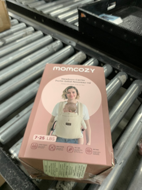 Photo 1 of Momcozy Newborn Carrier WeeSnug- Lightweight and Cozy Comfort for 7-25 lbs, Ergonomic Cross-Back Support, Effortless to Put On, Hands-Free Baby Carrier with Lumbar Support, Khaki
