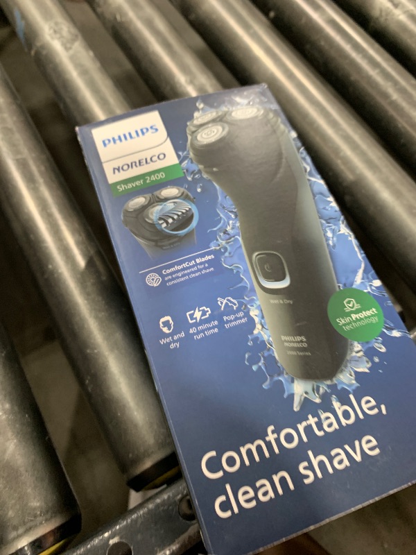 Photo 1 of Philips Norelco Shaver 2400 Series, Wet and Dry Electric Shaver, Pop-up Trimmer, P-Cap, Deep Black, Model X3001/90