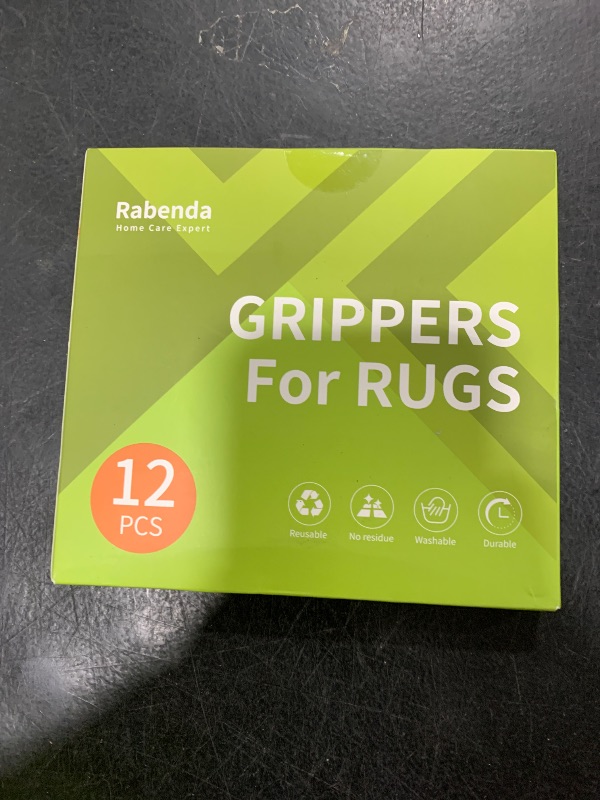 Photo 1 of Rabenda 12 Pcs Rug Tape, Non Slip Rug Pads Grippers for Hardwood Floors and Tiles, Reusable Carpet Tape for Area Rugs, Double-Sided Adhesive Rug Stickers Keep Corners Flat (Black)