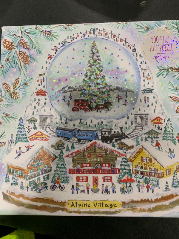 Photo 1 of Galison Michael Storrings Alpine Village Snow Globe – 500 Piece Foil Puzzle of Christmas Snow Filled Mountains Artwork with Gold Foil Accents