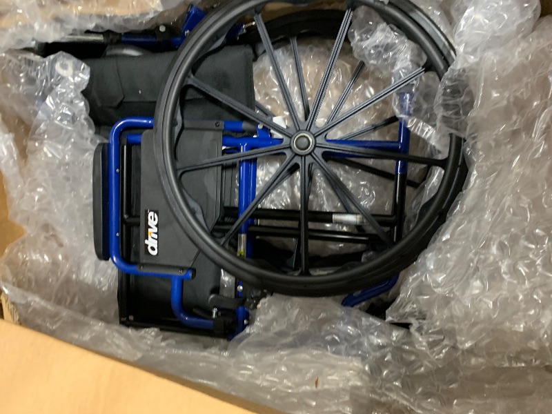 Photo 1 of Drive Medical Blue Streak Wheelchair with Flip Back Desk Arms, Elevating Leg Rests Folding Outdoor Desk Length Arms,Alloy Steel 20 Inch Seat