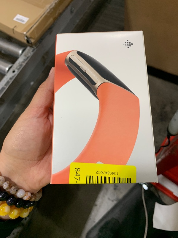 Photo 1 of Fitbit Charge 6 Fitness Tracker with Google apps, Heart Rate on Exercise Equipment, 6-Months Premium Membership Included, GPS, Health Tools and More, Gold/Coral, One Size (S & L Bands Included)