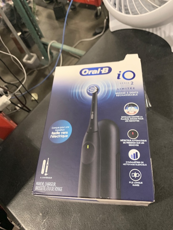 Photo 1 of Oral-B iO Simple Clean Rechargeable Electric Powered Toothbrush, Night Black with 1 Gentle Care Brush Head and 1 Black Travel Case - Automatic Pressure Sensor to Protect Gums - 3 Modes - 2 Min Timer