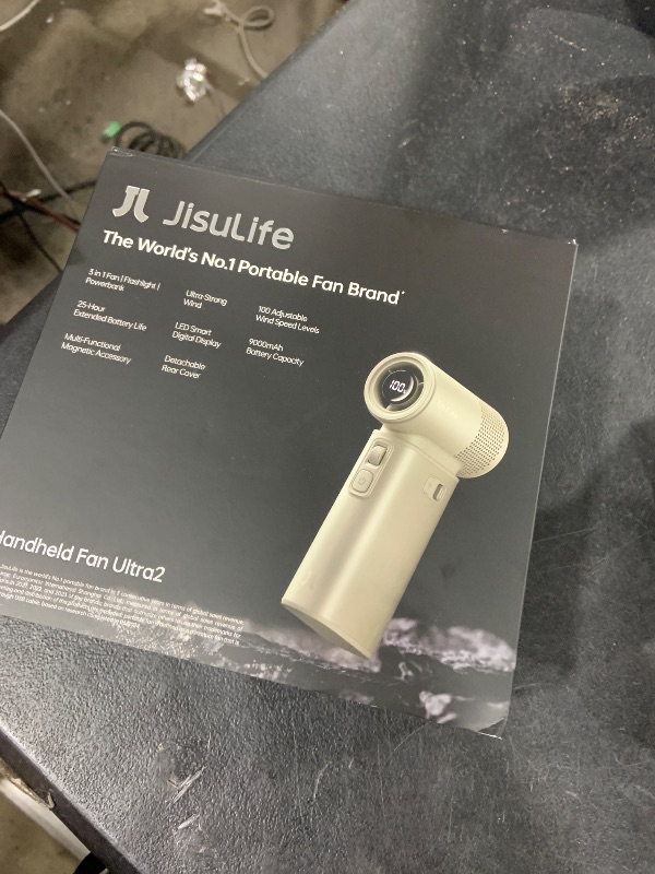 Photo 1 of JISULIFE Portable Handheld Fan Ultra2, 9000mAh Max 25 Hrs, 5 IN 1, 100 Speed Turbo Fan Rechargeable 18W Power Bank with Flashlight, Metal Shell Multi-Function Travel Essentials Gifts for Men-Brown