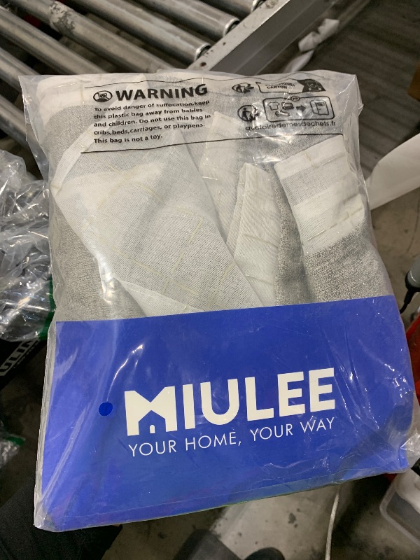 Photo 1 of MIULEE Blackout Curtains for Bedroom Living Room 63 Inches Long 2 Panels, Thermal Insulated Room Darkening Drapes Solid Grommet Noise Reduction Light Blocking Window Curtains 40x63 Inch Greyish White