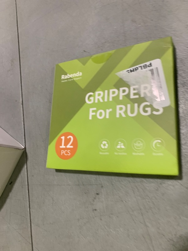 Photo 1 of Rabenda 12 Pcs Rug Tape, Non Slip Rug Pads Grippers for Hardwood Floors and Tiles, Reusable Carpet Tape for Area Rugs, Double-Sided Adhesive Rug Stickers Keep Corners Flat (Black)