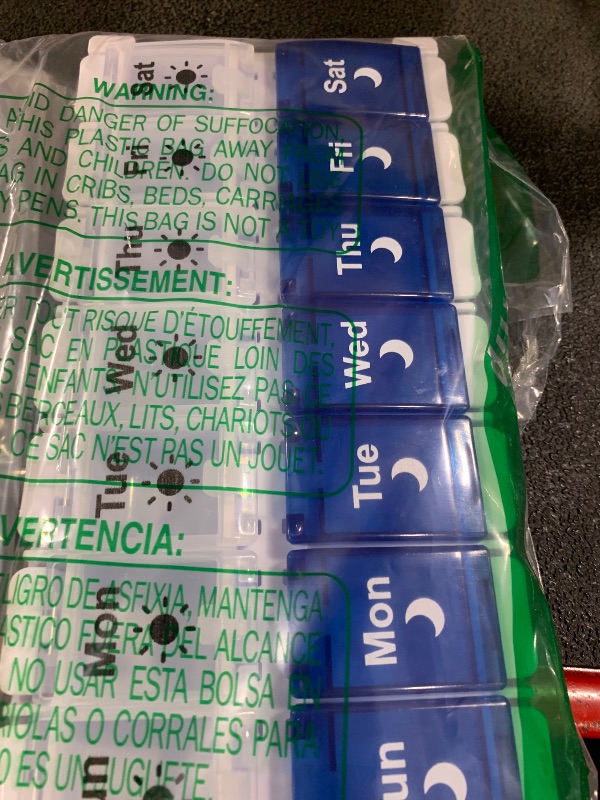 Photo 1 of Shintop Weekly Pill Organizer 2 Times a Day, Easy Fill Am Pm Pill Box 7 Day Push Button Medicine Holder Daily for Vitamins Supplements(Blue & White)