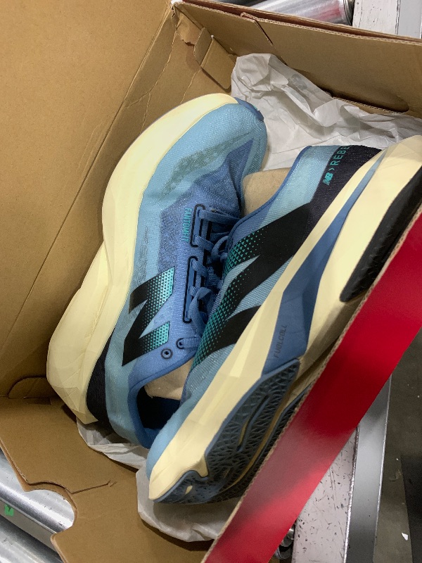 Photo 1 of New Balance Men's FuelCell Rebel V4 Running Shoe, Heron Blue/Chrome Blue/Black, 10 Wide