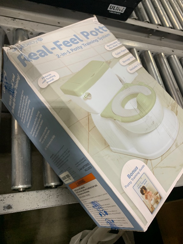 Photo 1 of Real Feel 2-in-1 Potty with Wipes Storage, Flushing Sounds & Disposable Liners - Realistic Toilet - Easy to Clean & Assemble - Jool Baby (Sage)