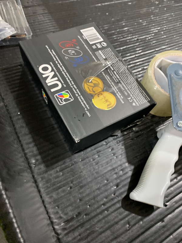 Photo 1 of Mattel Games UNO Premium 50th Anniversary Edition Matching Card Game Featuring Commemorative Coin & 112 Cards, Game Night, Kids & Collectors Gift Ages 7 Years & Older.