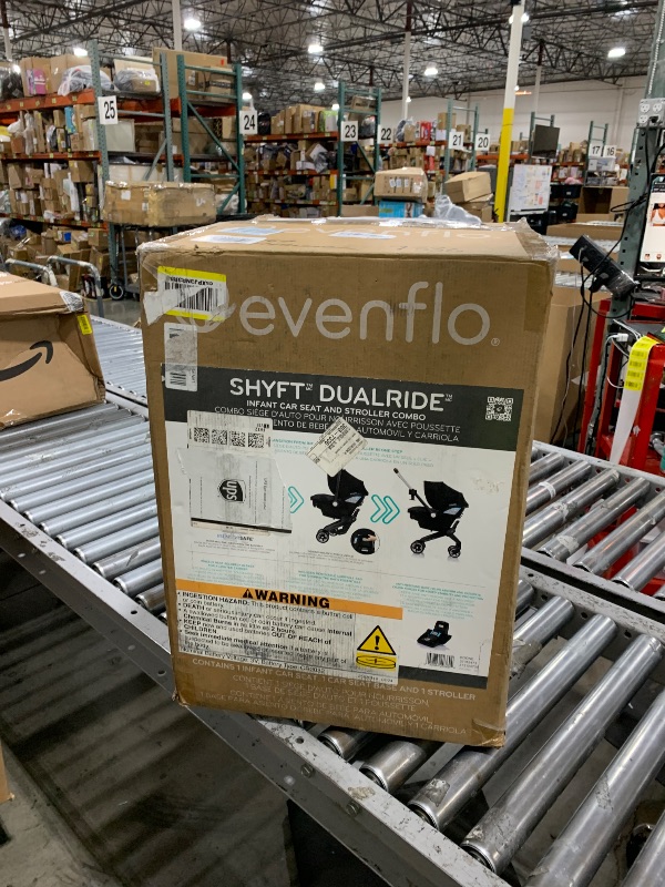 Photo 1 of Evenflo Shyft DualRide Infant Car Seat and Stroller Combo with Carryall Storage (Boone Gray)
