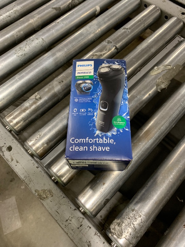 Photo 1 of Philips Norelco Shaver 2400 Series, Wet and Dry Electric Shaver, Pop-up Trimmer, P-Cap, Deep Black, Model X3001/90