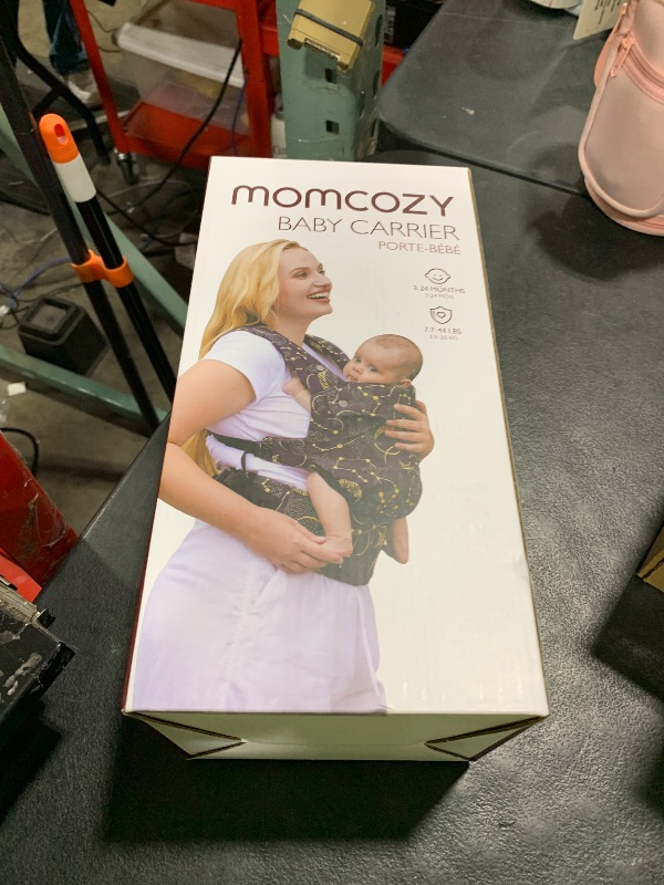 Photo 1 of Momcozy Baby Carrier - Ergonomic, Cozy and Lightweight Carrier for 3-24 Months, Effortless to Put On, Ideal for Hands-Free Parenting, Enhanced Lumbar Support, Purehug for Infant to Toddler, Black
