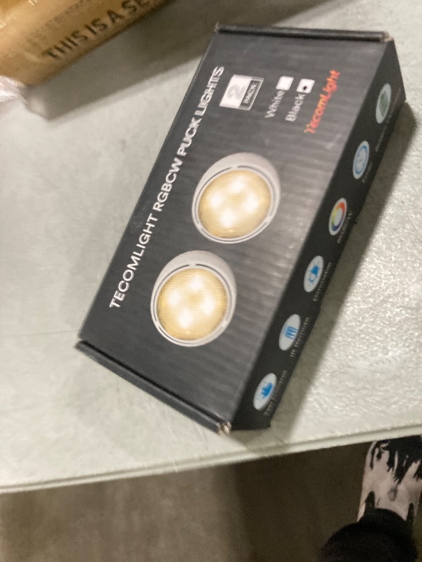Photo 1 of TECOMLIGHT LED Puck Lights with Remote Control, Battery Operated Wireless Closet Lights, Under Cabinet Lighting Stick on Tap Push Light, Color Changing Under Counter Light for Kitchen, 2 Pack - Black