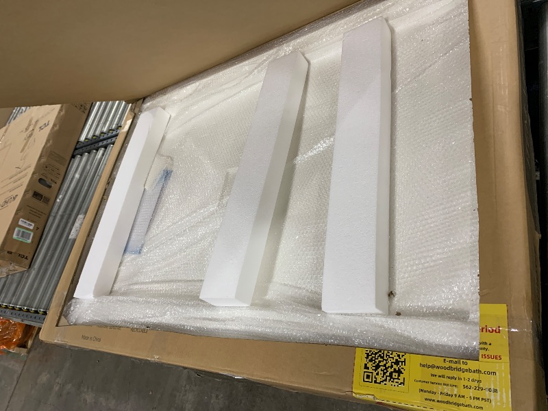 Photo 1 of WOODBRIDGE 48 in. x 32 in. Solid Surface Shower Pan Base in White, Alcove Installation with Center Drain, Slip-Resistant & Mold-Resistant
