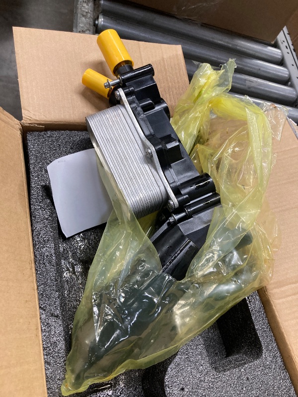 Photo 1 of **T IS USED, IT IS MISSING PARTS AND IT IS NOT KNOWN IF IT WORKS AT 10%**Engine Oil Cooler 68105583AF 68105583AC 68105583AE 68105583AA 68105583AB