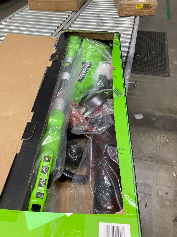 Photo 1 of **IT IS USED, IT IS MISSING PARTS AND IT IS NOT KNOWN IF IT WORKS AT 100%**Greenworks 24V 12-Inch Cordless String Trimmer/Edger and Leaf Blower Combo Kit + 3 Bonus Spools, 2.0Ah Battery and Charger Included