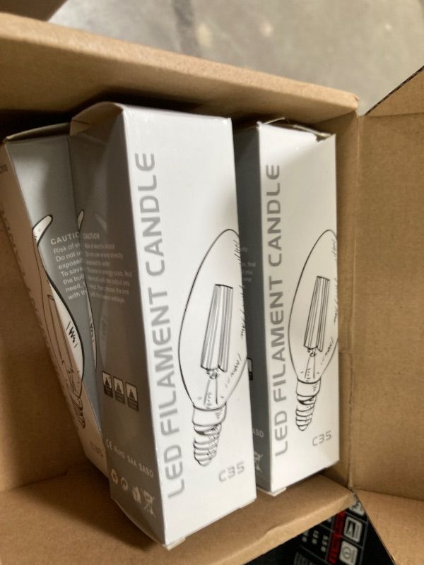 Photo 1 of **MISSING 2***PANLAVIE LED Filament Chandelier Bulb 4W, Vintage Classic Edison Style, E26 Standard Base Amber Glass Light Bulbs, Gold Tint Flame Tip, 40W Equivalent, Ultra Warm White 2200K, Pack of 6