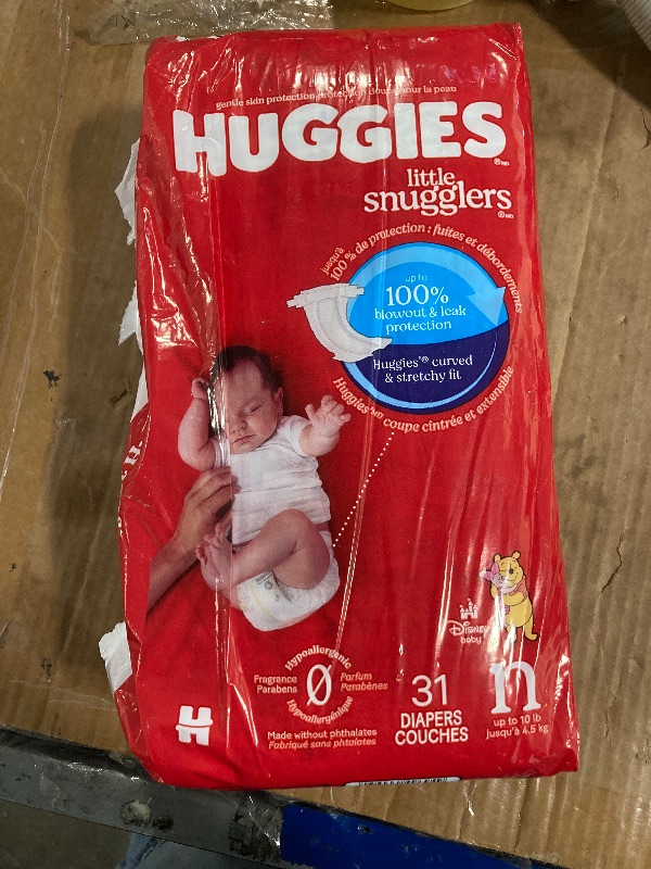 Photo 1 of ****FRABIC SEALED***Huggies Size Newborn Diapers, Little Snugglers Baby Diapers, Size Newborn (up to 10 lbs), 31 Count, Packaging May Vary