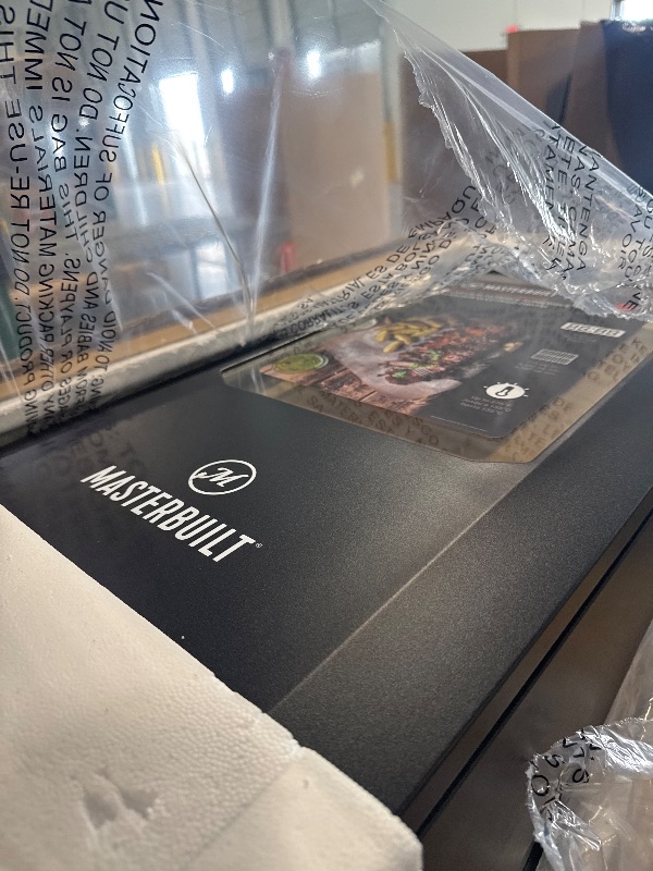 Photo 1 of ****BRAND NEW ITEM**** Masterbuilt® 30-inch Digital Electric Vertical BBQ Smoker with Leg Kit, Side Wood Chip Loader and 710 Cooking Square Inches in Black, Model MB20070421