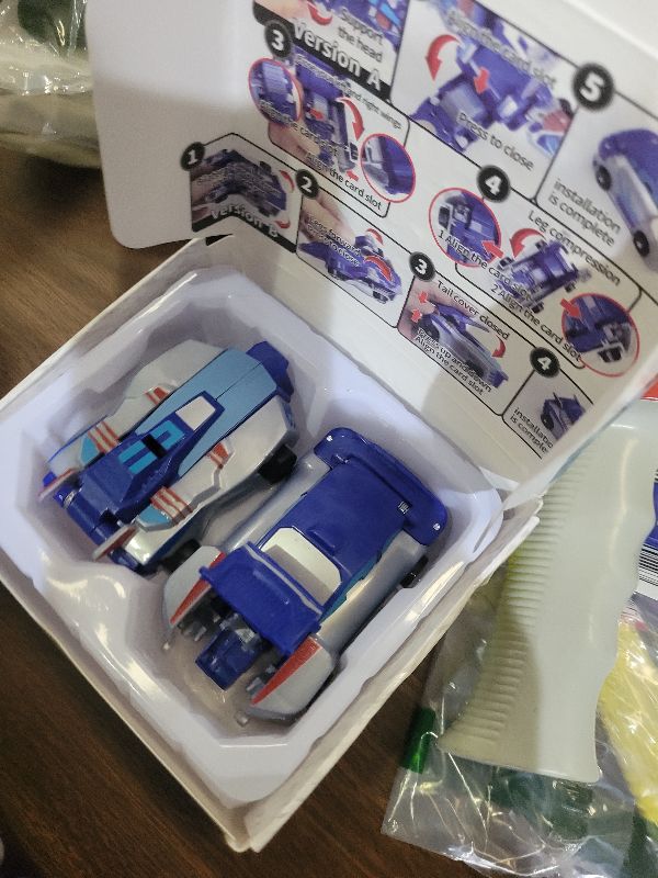 Photo 1 of Intoypad Collision Transforming Dinosaur Car Toy, 2 Magnetic Cars Transform into Dinosaur Toys for Kids Toddler Fun Deformation Robot Dino Car Christmas Birthday Gift Toys for Boys Girls(Blue Dragon)