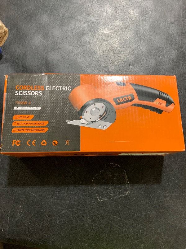 Photo 1 of LKCTB Electric Cardboard Cutter Scissors with LED Light, 2600mAh Rechargeable Battery, Brushless Motor, Tungsten Steel Blade, Cuts Cloth, Leather, Carpet, light orange