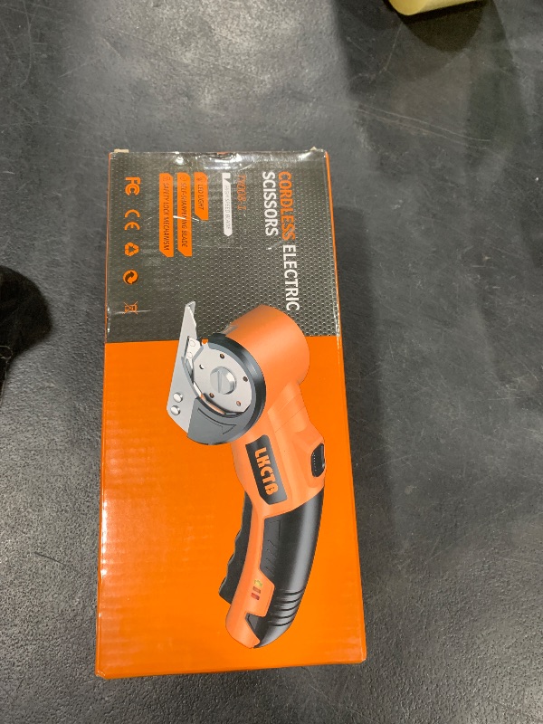 Photo 1 of LKCTB Electric Cardboard Cutter Scissors with LED Light, 2600mAh Rechargeable Battery, Brushless Motor, Tungsten Steel Blade, Cuts Cloth, Leather, Carpet, light orange