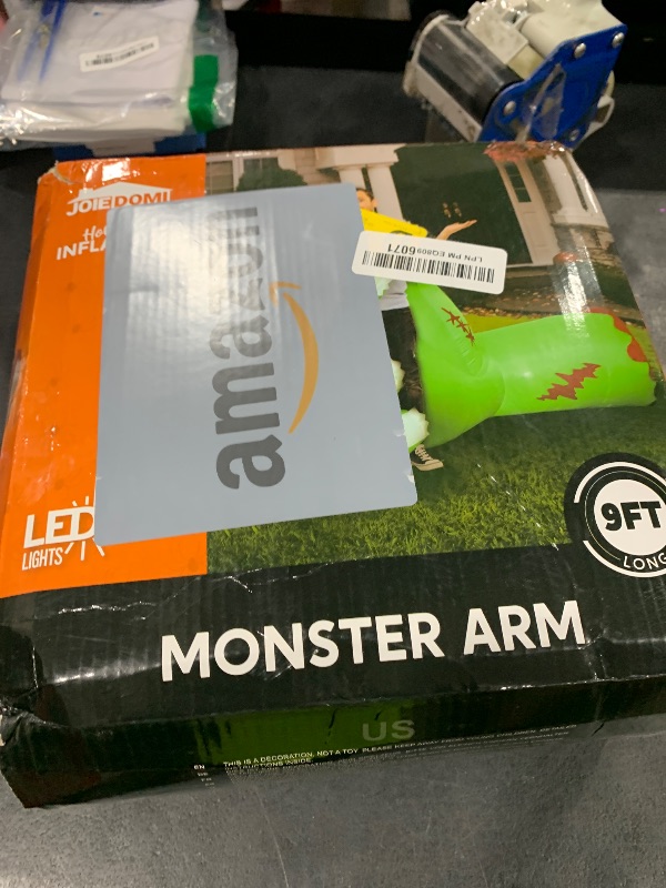 Photo 1 of Joiedomi 9 Ft Long Giant Halloween Inflatables Zombie Arm Outdoor Decoration, Giant Arm Blow Up Yard Decoration with Built-in LEDs, Halloween Inflatables Zombie Arm Party Supplies for Yard Garden Lawn