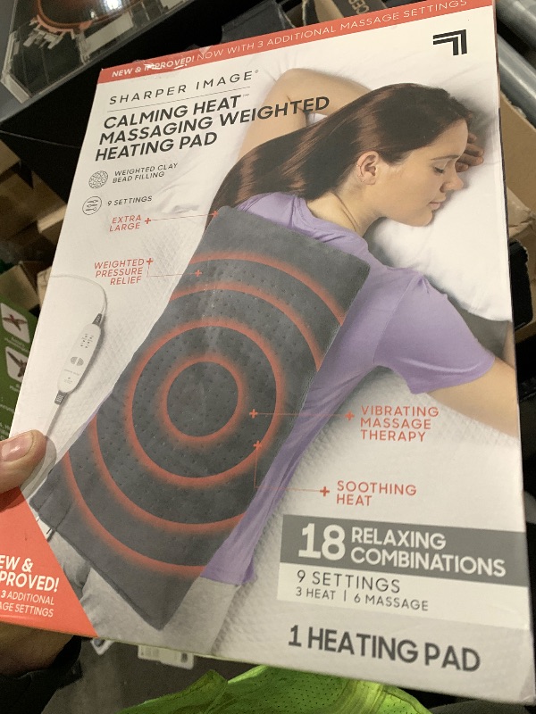 Photo 1 of Calming Heat Massaging Weighted Heating Pad by Sharper Image- Weighted Electric Heating Pad with Massaging Vibrations, 9 Settings- 3 Heat, 6 Massage- 18 Relaxing Combinations, 12” x 24”, 4 lbs