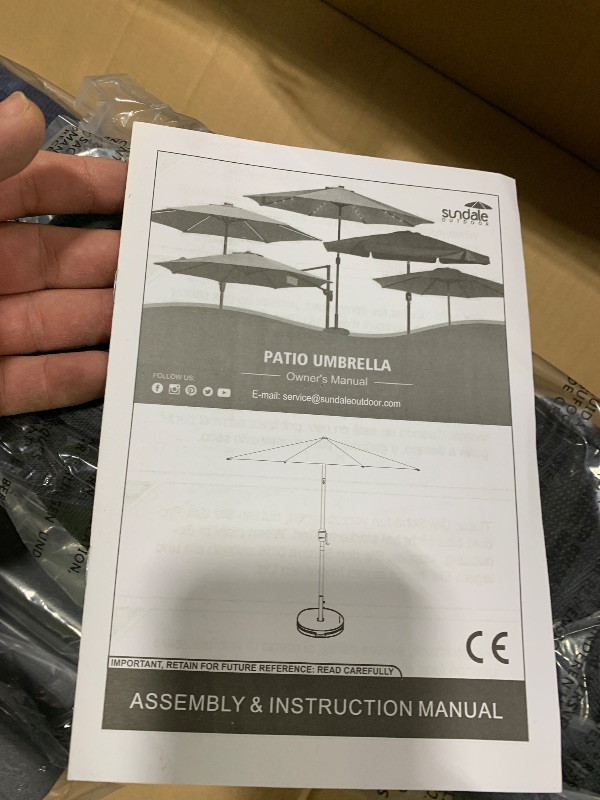 Photo 1 of Sundale Outdoor Olefin 5-Year-Non-Fading 10FT Patio Umbrella with Sand Bag Base, Outdoor Umbrella with Tilt and Crank, Navy