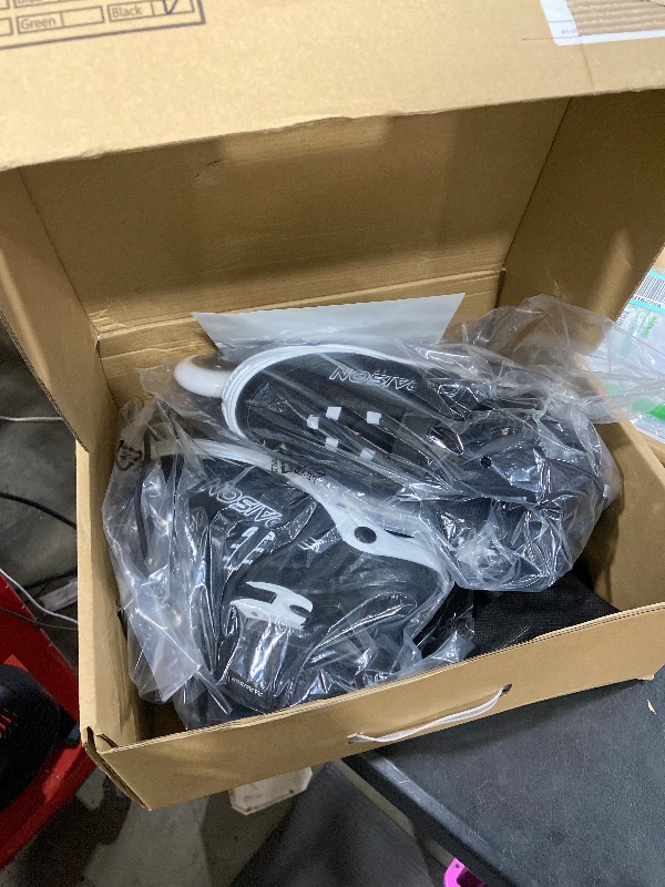 Photo 1 of *PICTURE FOR REFERENCE*
BLACK AND WHITE PAPAISON Adjustable Inline Skates for Kids and Adults. SIZE L.